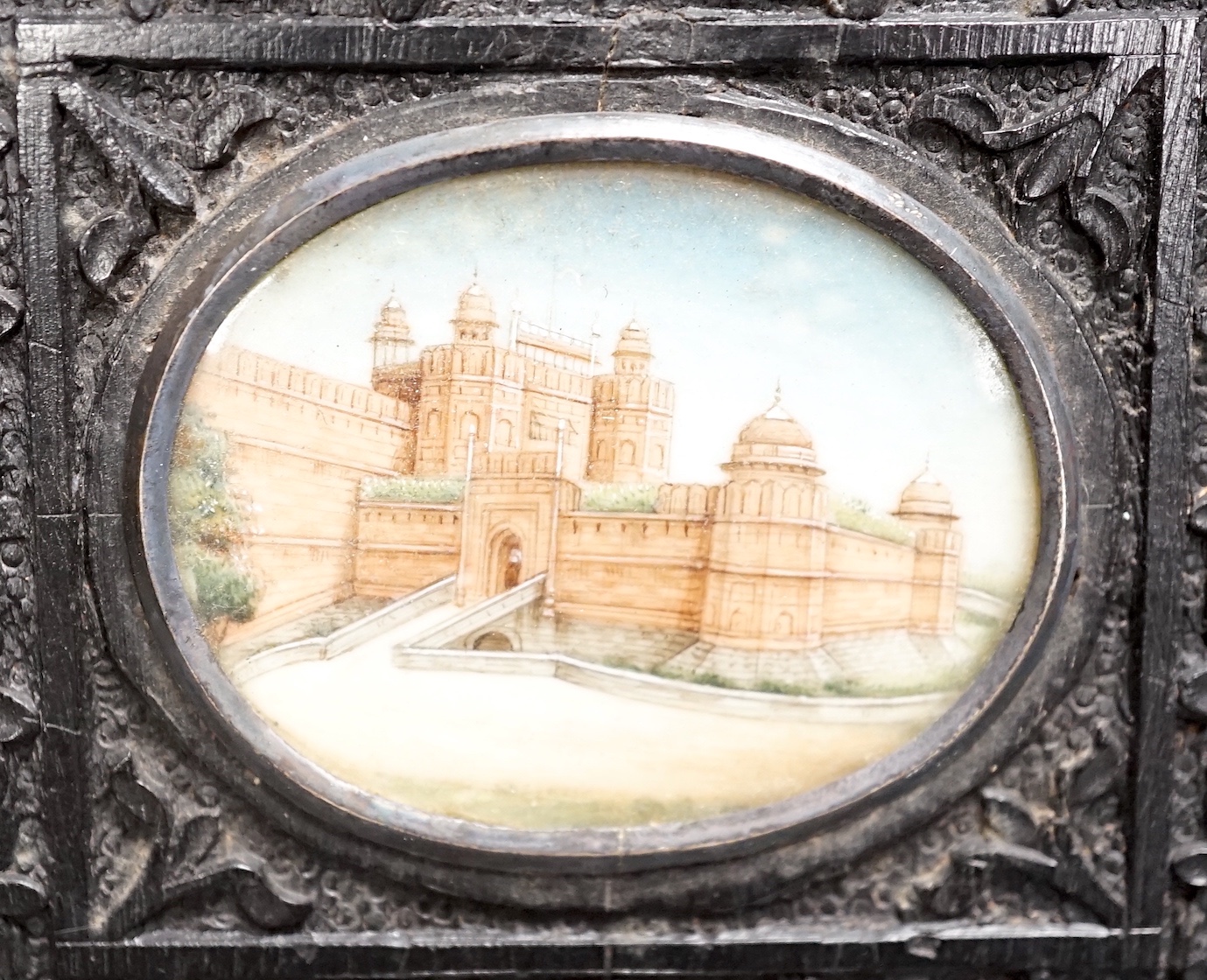 A pair of Indian miniatures on ivory, early 20th century, in ebony frames, 12 cm high